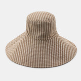 Beige checkered sun hat on a white background
