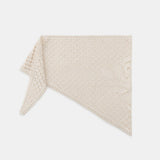 Beige textured blanket on a white background
