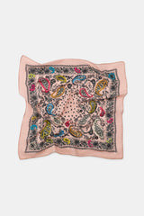 Decorative square scarf with colorful paisley pattern on a light pink background