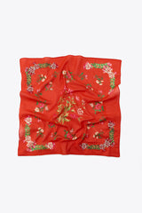 Red scarf with floral patterns on a white background