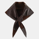 A dark brown leather neck scarf with a pointed, folded shape and tied ends, displayed on a light gray background.