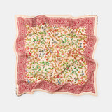 Floral patterned scarf with red border on a white background