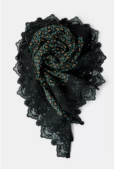 Product listings on a shopping app with images of bags, headscarves, and scarves.