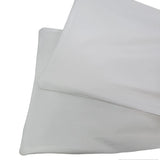 Two light gray pillows on a white background