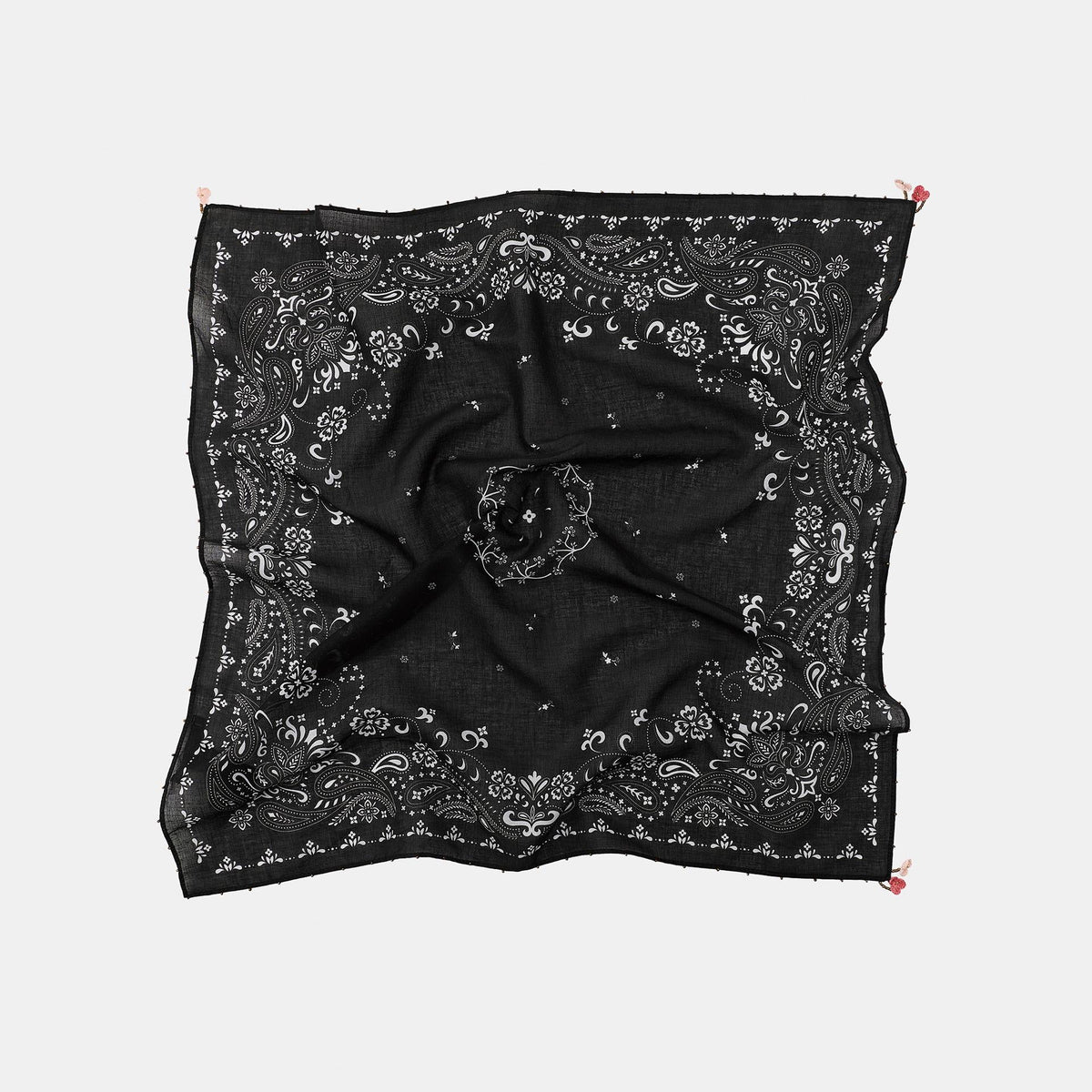Black patterned scarf with a bow on a white background