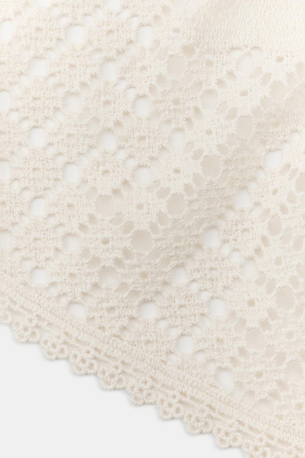 Close-up of a textured beige fabric with a subtle pattern