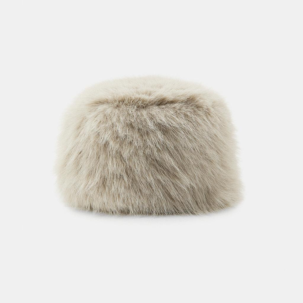 Furry beige headband on a white background