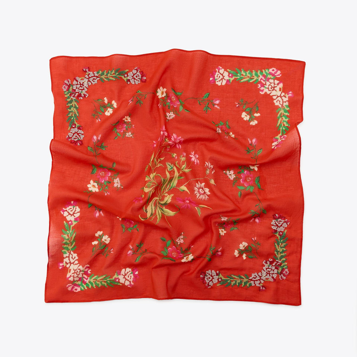 Red scarf with floral patterns on a white background