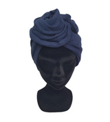 Navy blue headscarf on a black mannequin head against a white background