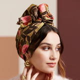 Woman wearing a floral headscarf with a soft background