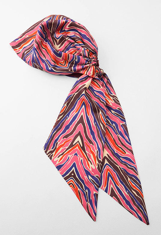 Colorful patterned headscarf on a white background