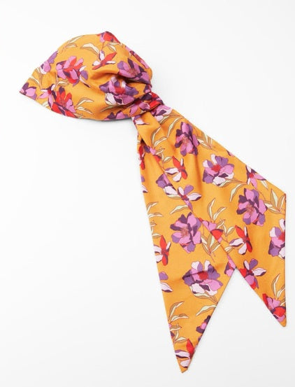 Yellow headscarf with floral pattern on a white background