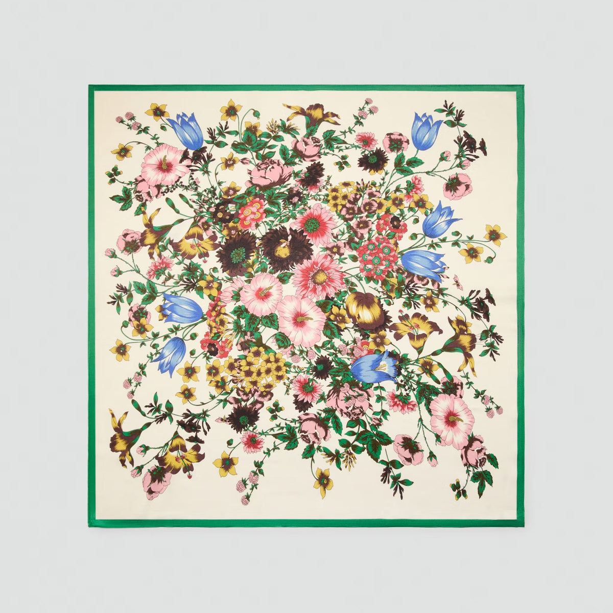 Floral patterned fabric square with a green border on a light gray background